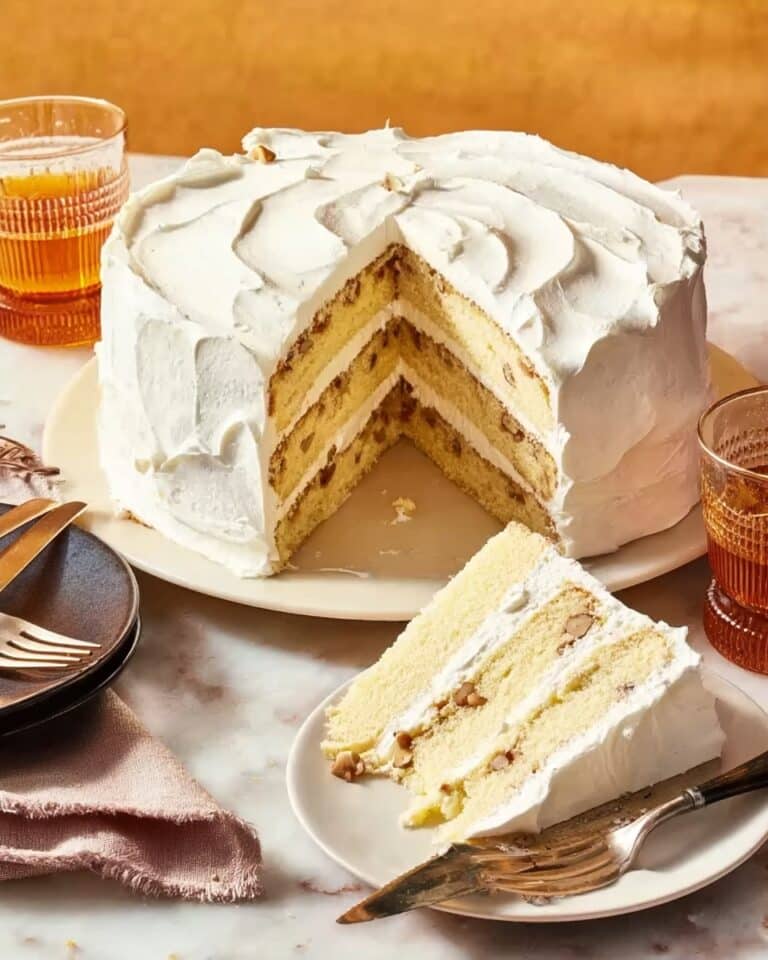 Lady Baltimore Cake with Rum-Soaked Raisins and Nutty Fruit Filling Recipe