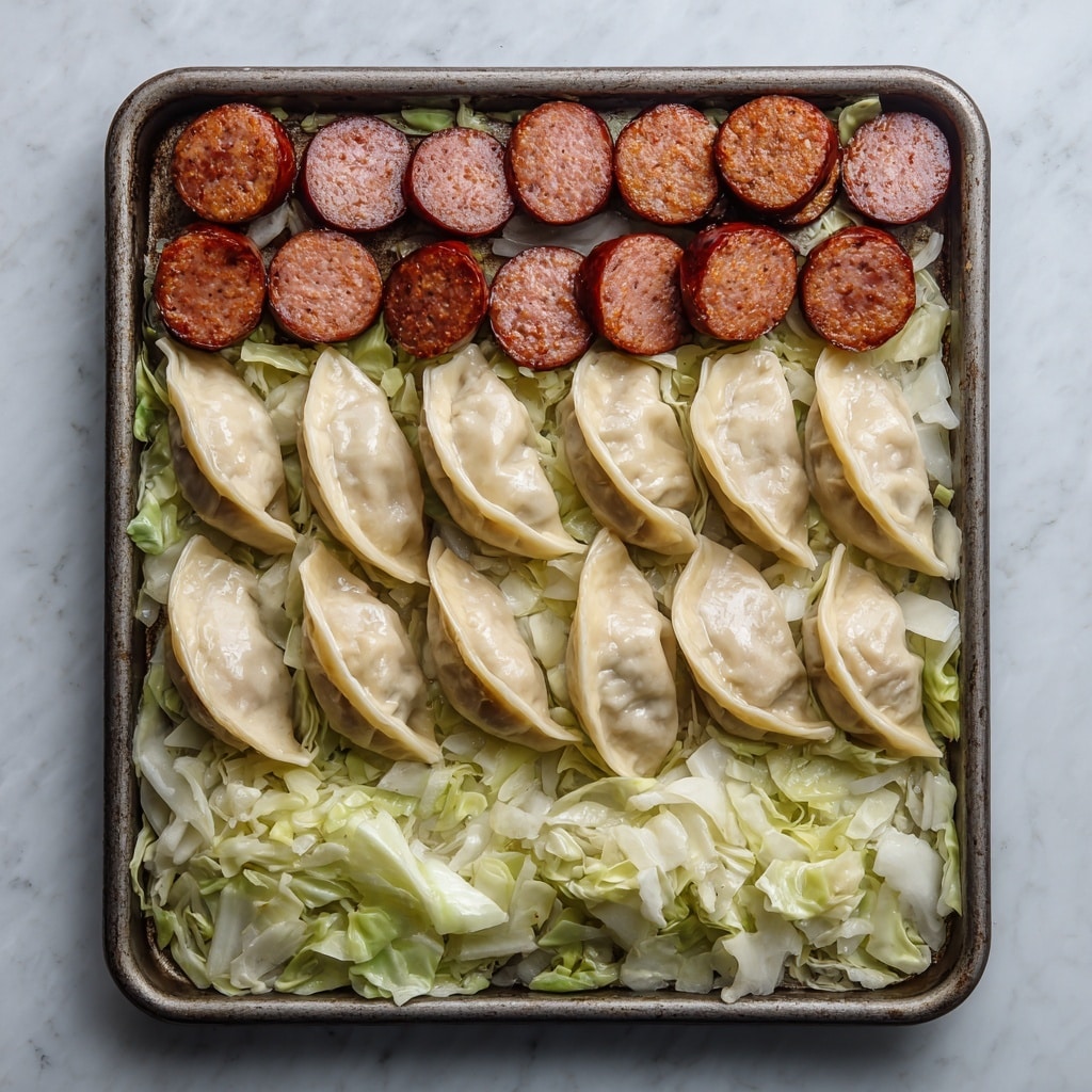 The image shows a baking tray filled with three distinct layers of food neatly arranged from top to bottom. The top layer consists of thick slices of red sausage, cut into round pieces and laid side by side. The middle layer is made up of semi-circular ravioli or dumplings that are white with a smooth texture, slightly piled in two rows. The bottom layer is a spread of chopped green leafy vegetables, likely cabbage or lettuce, with some white parts visible, covering the entire bottom section of the tray. The baking tray sits on a surface with a white marbled texture. Photo taken with an iphone --ar 4:5 --v 7